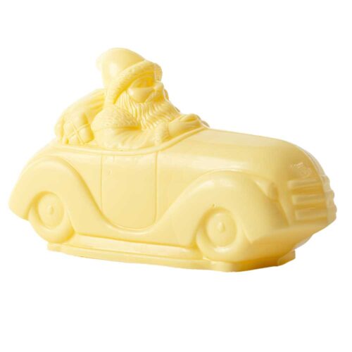 A swhite chocolate santa in a car